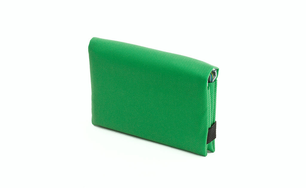 visible variant TB1275-GJ^^The Size 5 Nik's Minimalist Wallet in Grass (bright green) 210 Ballistic closed interior pockets-out with the attached elastic band.