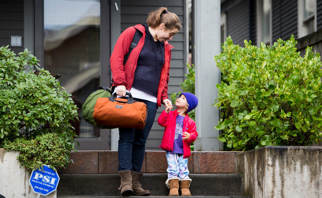 visiblelifestyle  ^^ A person carrying a Mini Yeoman and a Large Yeoman with a Shoulder strap while helping a small child down some stairs.