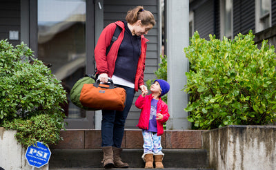 visiblelifestyle  ^^ A person carrying a Mini Yeoman and a Large Yeoman with a Shoulder strap while helping a small child down some stairs.