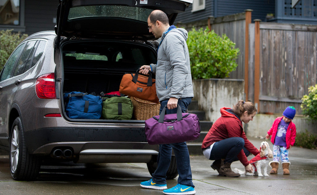 lifestyle visible ^^ A person packing a variety of Yeoman sizes into the back of a car.