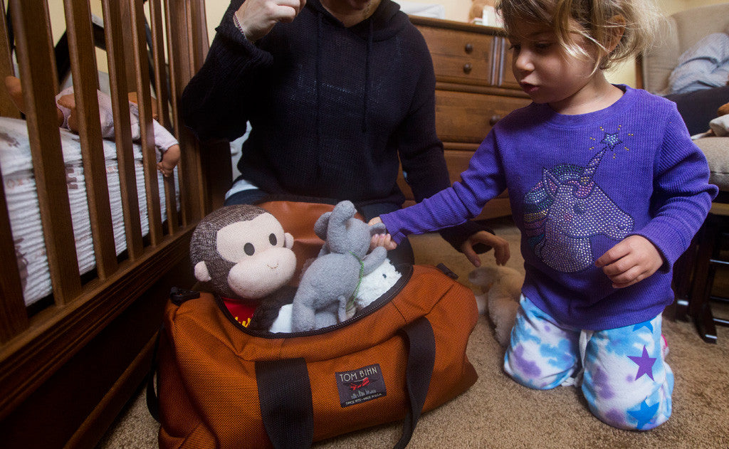 visible lifestyle ^^ A child packing stuffed toys into a Mini Yeoman Duffel.