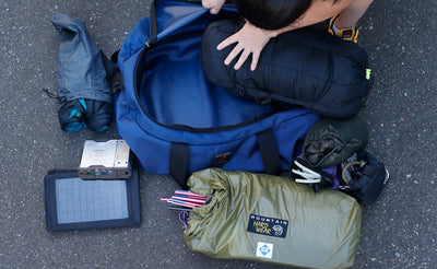lifestyle visible ^^ A person packing camping gear into a Large Yeoman Duffel.