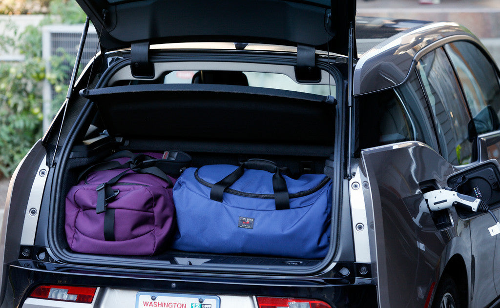lifestyle visible^^ Two Large Yeoman Duffels in the back of a hatchback car.