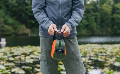 lifestyle visible^^Person holding the Grab Bag by its top handles.