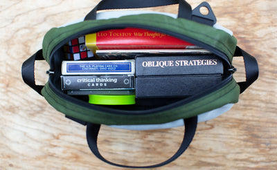 detail visible^^ A Silver sided Grab Bag filled with various card games. 
