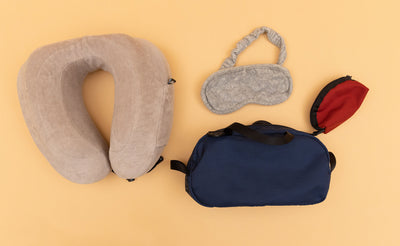 detail visible^^ A Navy Parapack Grab Bag with travel sleep accessories next to it including a Small Mars Red Q-Kit. 