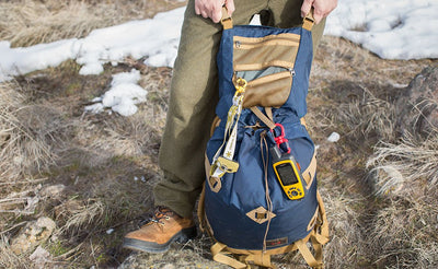 lifestyle visible^^A Large Double Carabiner connecting a GPS to a Guide's Pack.