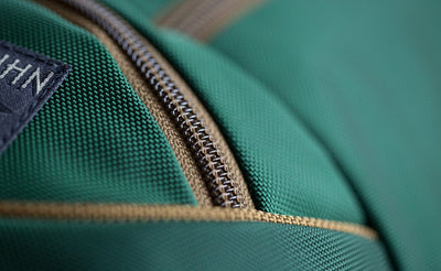 detail visible^^A close shot of the Coyote (brown) zipper and trim of the Guide's Edition Synik 22.
