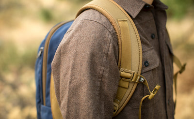 lifestyle visible^^A profile shot of a person wearing the Guide's Edition Synapse 25 with the sternum strap unbuckled.