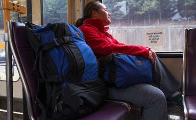 lifestyle visible^^A person with the main pocket of the Hero's Journey in their lap. 