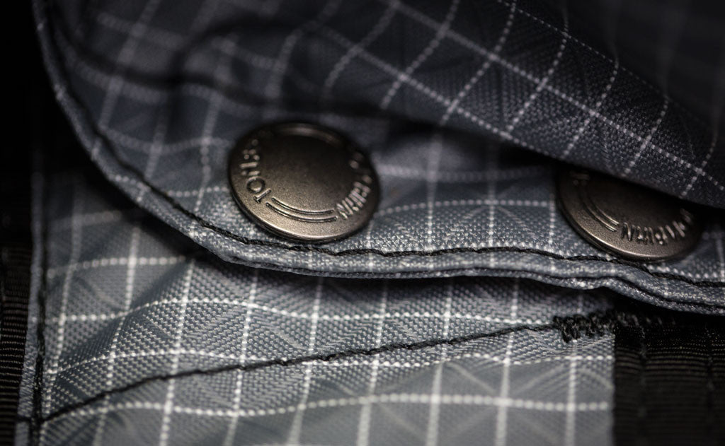 detail visible^^A close-up of the snaps for the removable frame sheet.