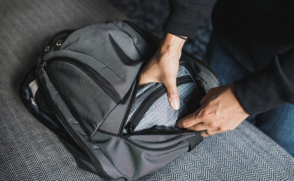 visible lifestyle ^^ A person retrieving the HLT1 from the bottom pocket of the Synik 22.
