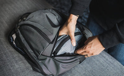 visible lifestyle ^^ A person retrieving the HLT1 from the bottom pocket of the Synik 22.