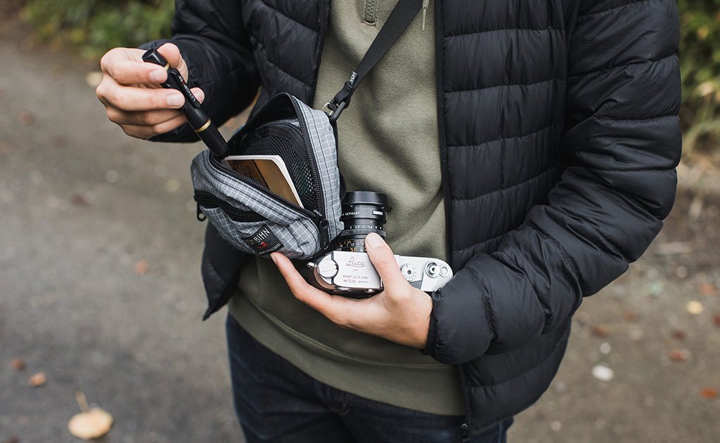 visible lifestyle ^^ A person retrieving a pen and camera from the HLT1.