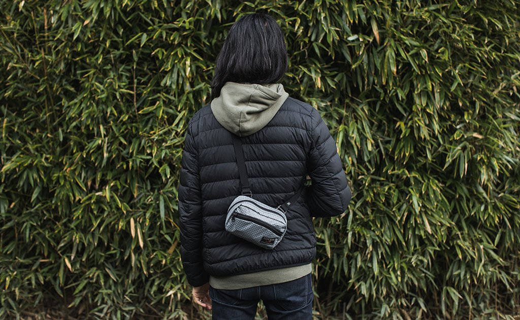 visible lifestyle ^^ The back of a person wearing the HLT1 as a sling pack.
