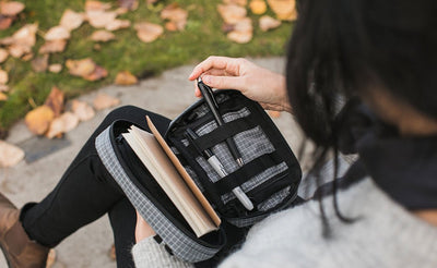 visible lifestyle ^^ A person retrieving a pen from the webbing loops in the HLT1