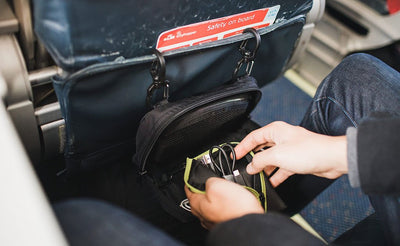 lifestyle ^^ A person retrieving cables from a pouch in their HLT2.