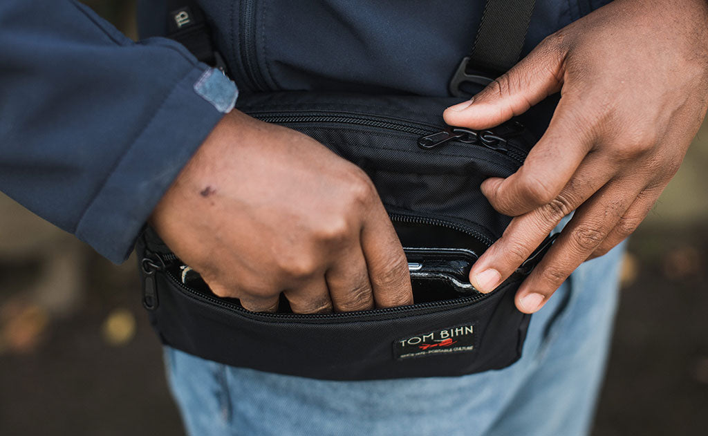 ^^ A person retrieving a phone from the front pocket of the HLT2.