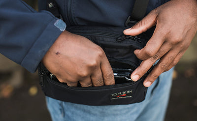 ^^ A person retrieving a phone from the front pocket of the HLT2.