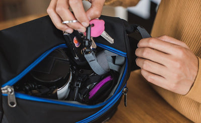 detail visible^^A person accessing a full main compartment of the Icon.