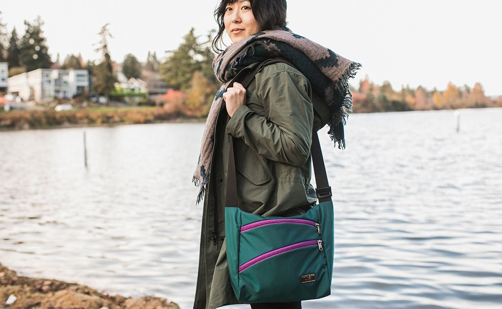 detail visible^^A person carrying the Icon as a shoulder bag.