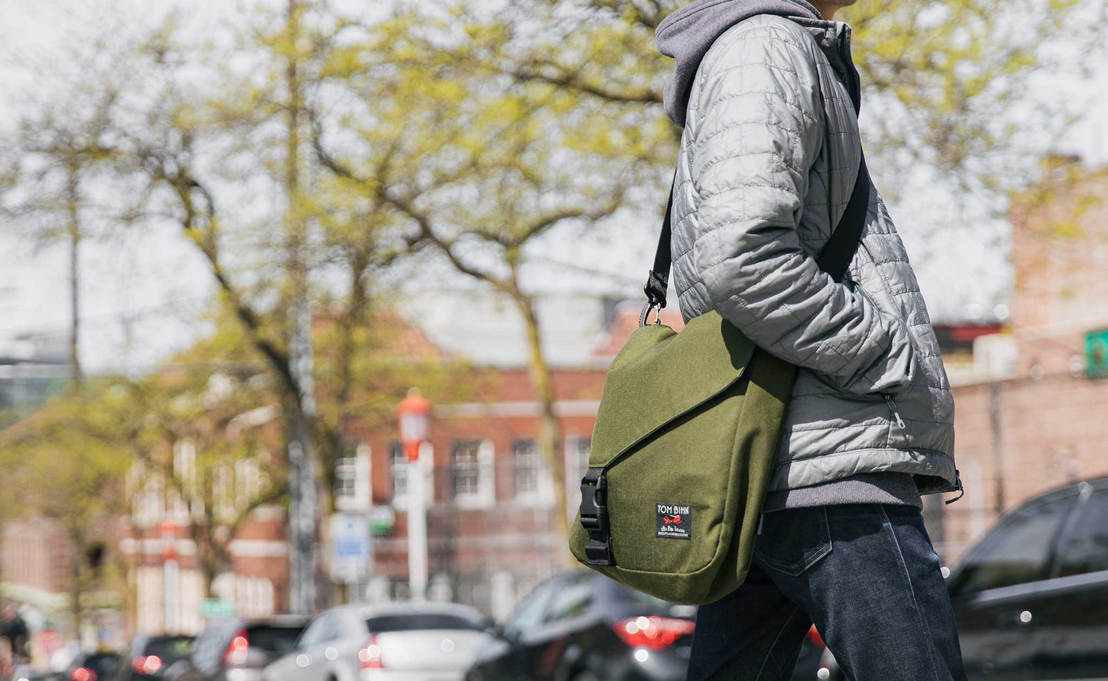 lifestyle visible^^Person wearing the Large Cafe Bag in 1000d Cordura Olive cross-body.