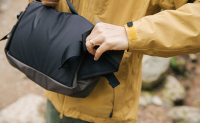 lifestyle visible^^Person tucking away the padded hip belt.