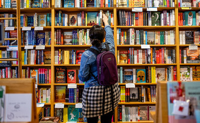 lifestyle visible^^A person wearing a Luminary 12 at a book store.