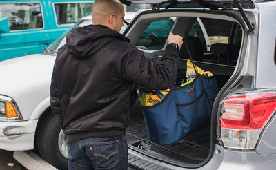 lifestyle visible^^A person putting the Monster Truck in a hatchback.