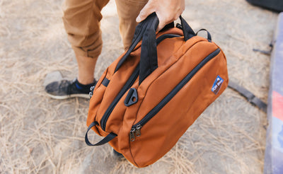 visible detail^^A person carrying the Old School Carry All by its handles