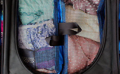 lifestyle visible^^Four (two levels of two each) filled Small or Small Laundry Packing Cubes fill the main compartment of the Aeronaut 30 with a little space at the top for small items.
