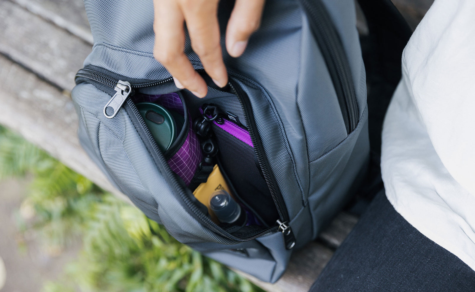 visible lifestyle^^The open front pocket of a Paradigm showing the water bottle pocket and the open-topped organizational pockets.