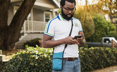 lifestyle visible^^A person carrying the P.I.K.A. Pouch.