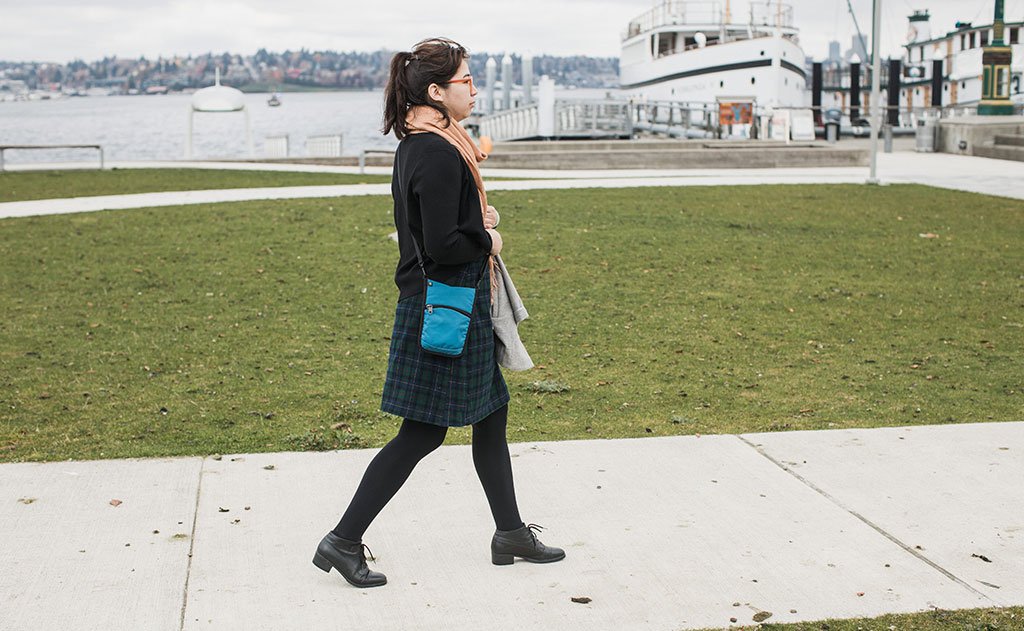 lifestyle visible^^A person carrying the P.I.K.A. Pouch.