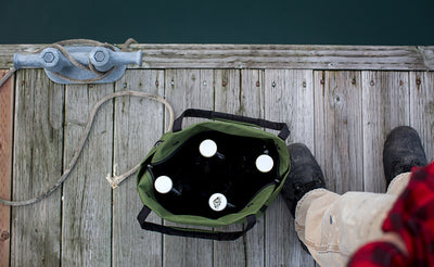 lifestyle visible^^A Pop Tote loaded up with 4 growlers.