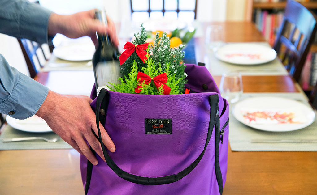 lifestyle visible^^A person grabbing some groceries from Pop Tote.