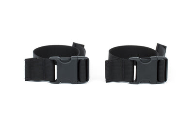 visible^^A pair of stroller/wheelchair adapter straps.