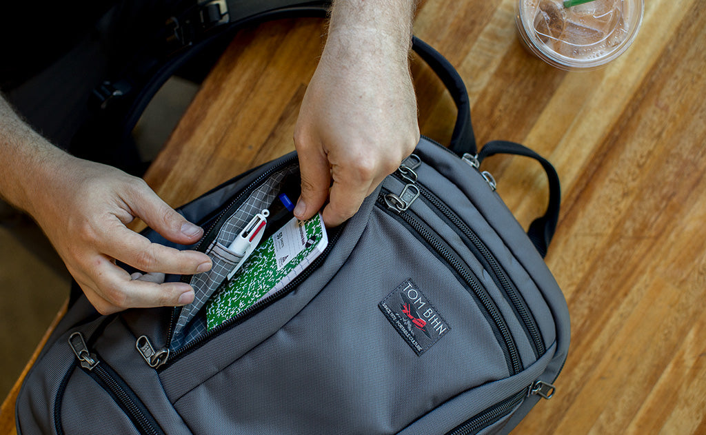 A person accessing the left pocket on the Synapse 19.