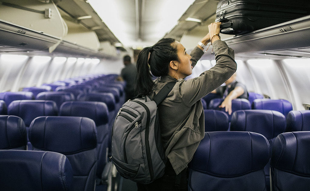 visible lifestyle^^person boarding a plane wearing a Synik 22