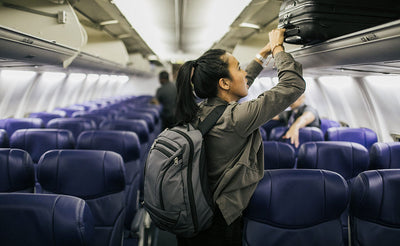 visible lifestyle^^person boarding a plane wearing a Synik 22