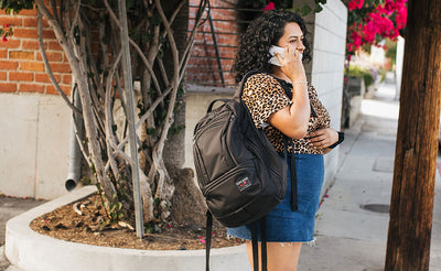 A person with the Synik 30 slung over one shoulder.
