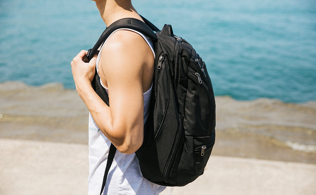 A person on a beach carrying the Synik 30.