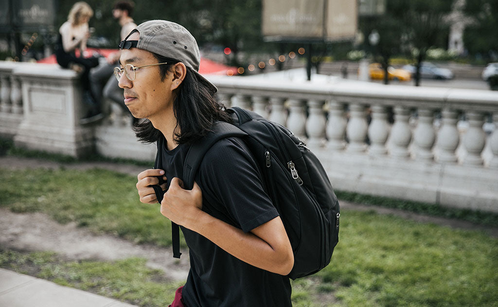 A person walking on a sidewalk with the Synik 30.