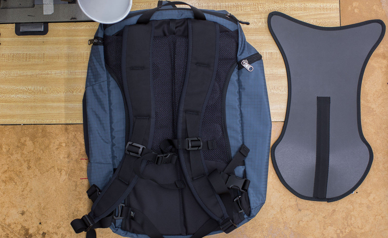 visible variant TB1814-BA TB1815-BA^^The optional Techonaut Internal Frame next to a Techonaut 30 in Night Walk 400d; both are on a sewing machine table in the TOM BIHN factory.
