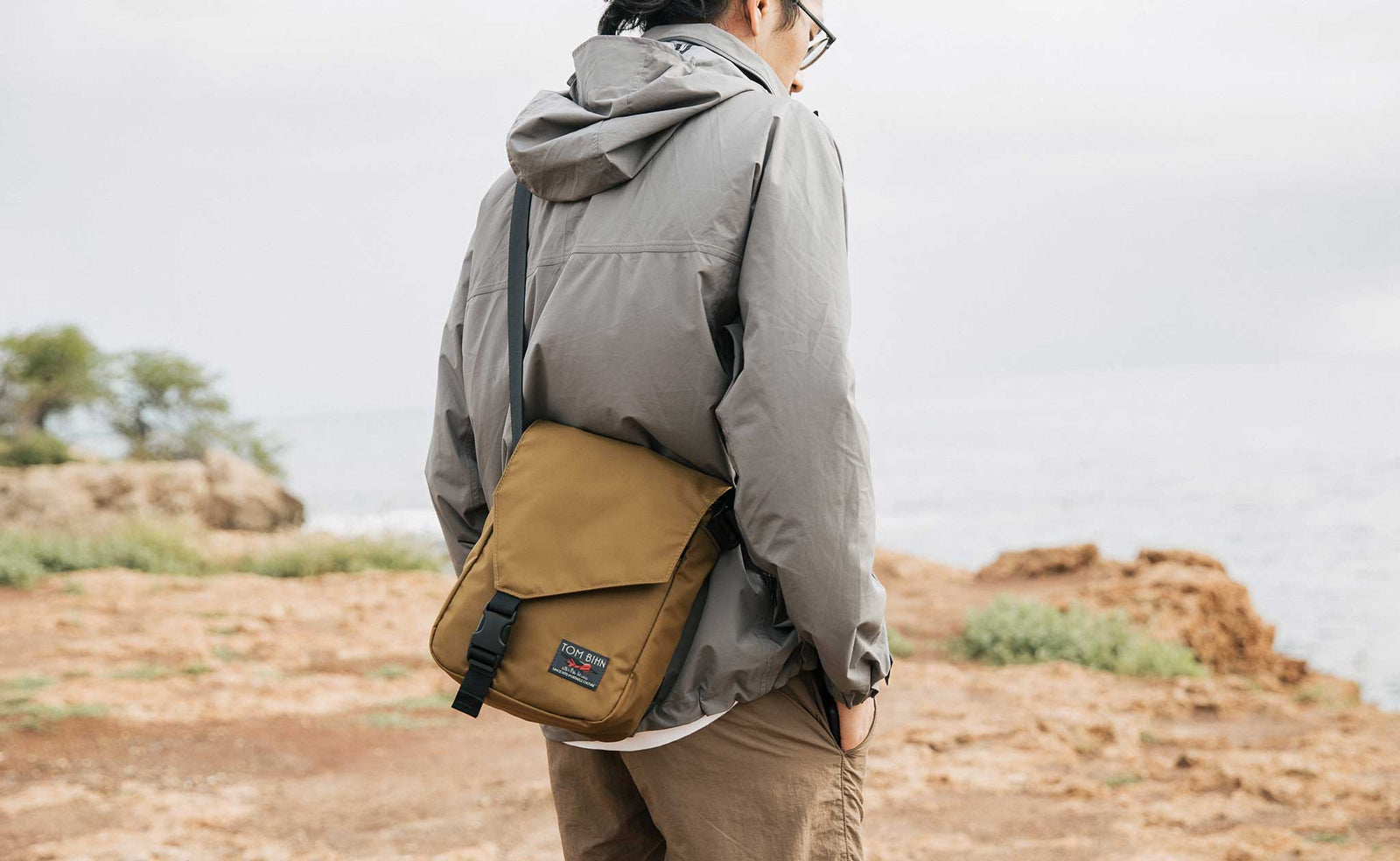 Person wearing the Small Cafe Bag in Coyote 210d ballistic.
