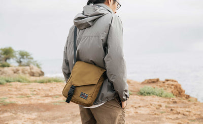 Person wearing the Small Cafe Bag in Coyote 210d ballistic.