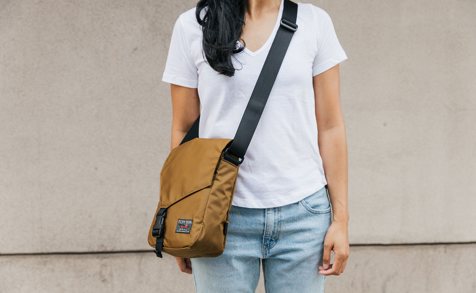 Person wearing the Small Cafe Bag in 210d ballistic, Coyote.