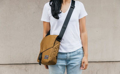 Person wearing the Small Cafe Bag in 210d ballistic, Coyote.