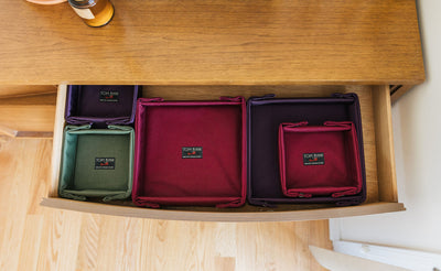 detail visible^^Various empty Tray Biens in a drawer.